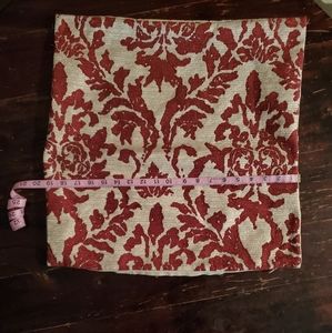 Two tan and red pillow covers
